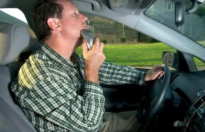 Man shaving while driving